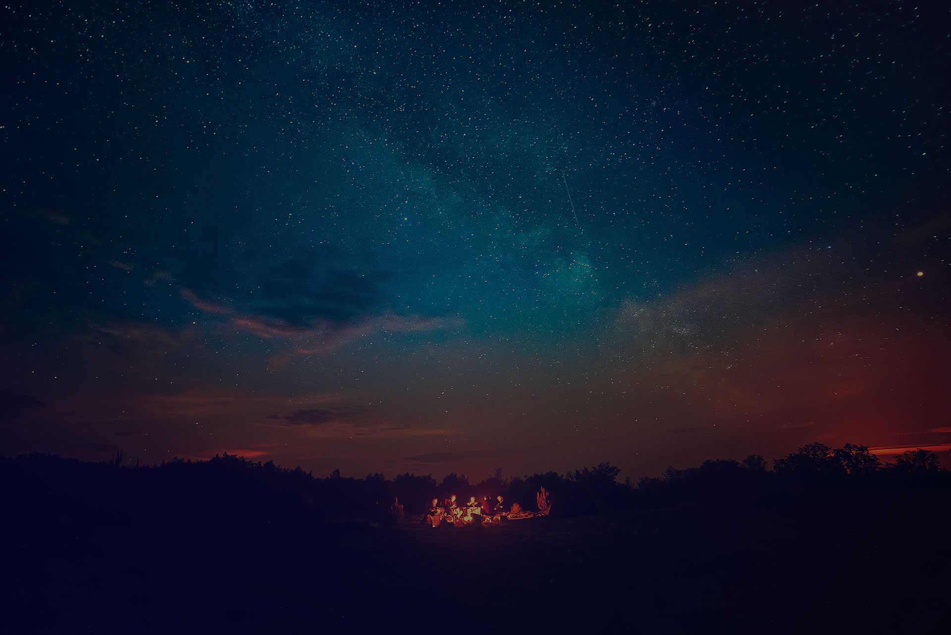 People sitting under the sky together